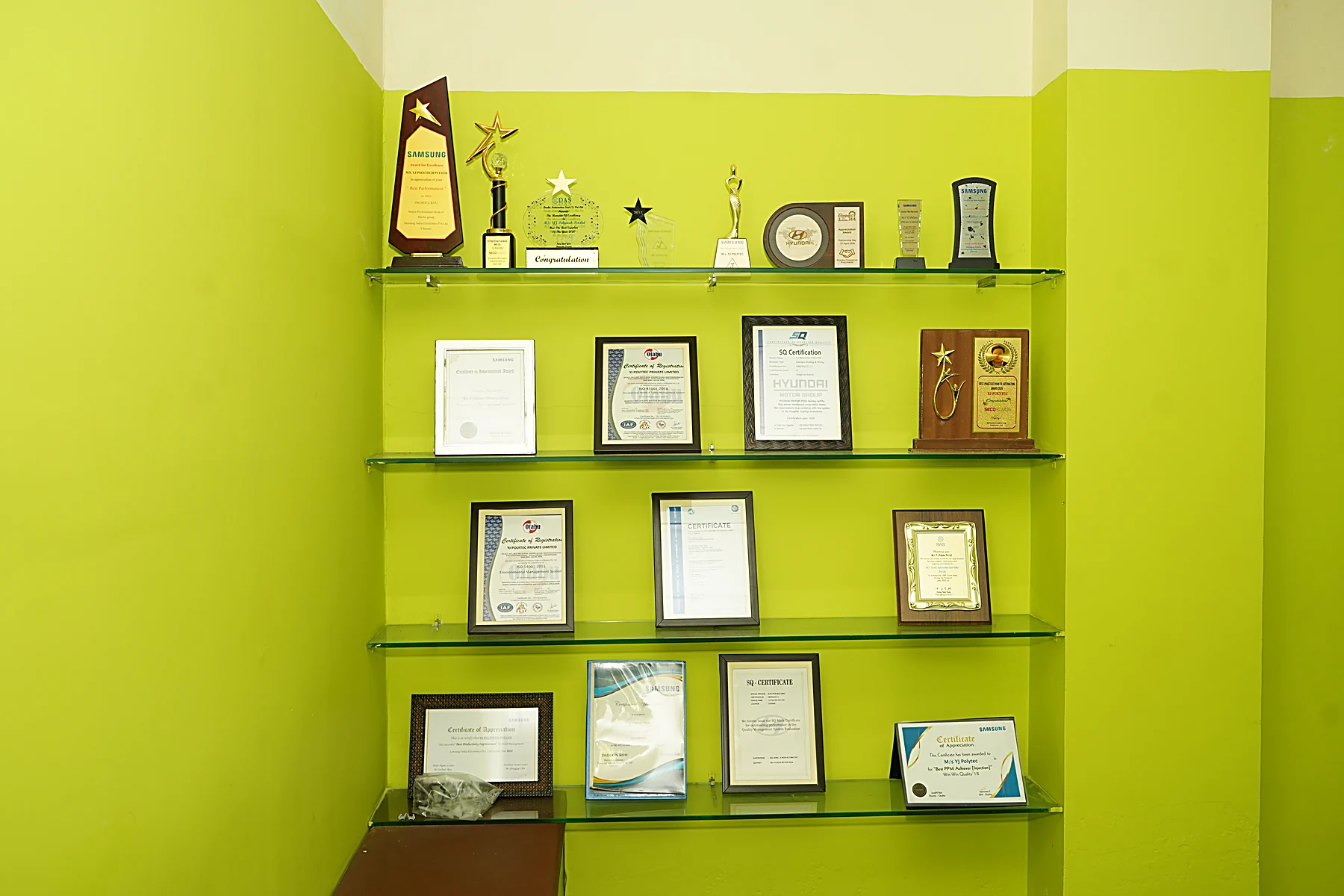 YJ Polytec awards, OEM appreciations and certifications wall at Sriperumbudur